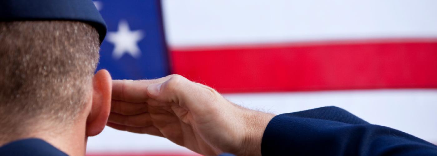 Soldier saluting the U.S. flag