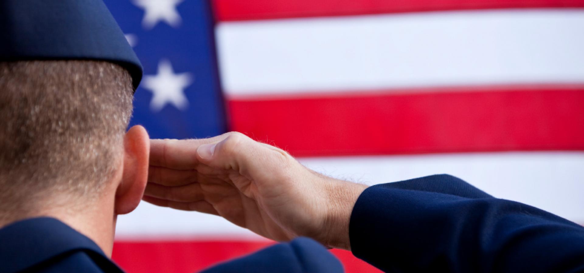 Soldier saluting the U.S. flag