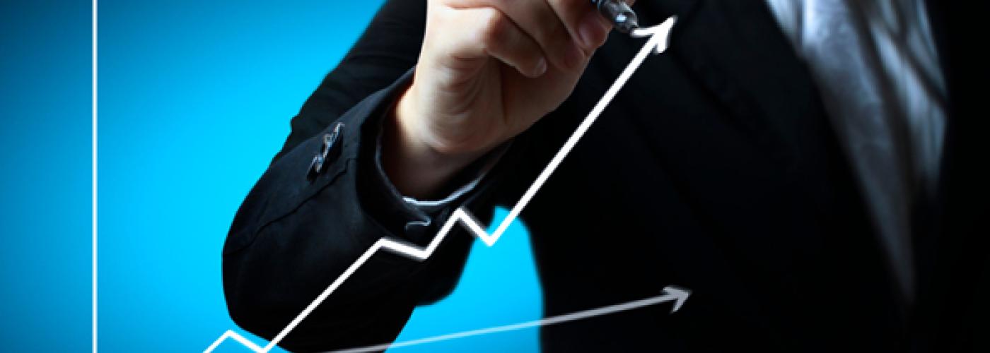 Business man hand drawing a graph Business man hand drawing a graph