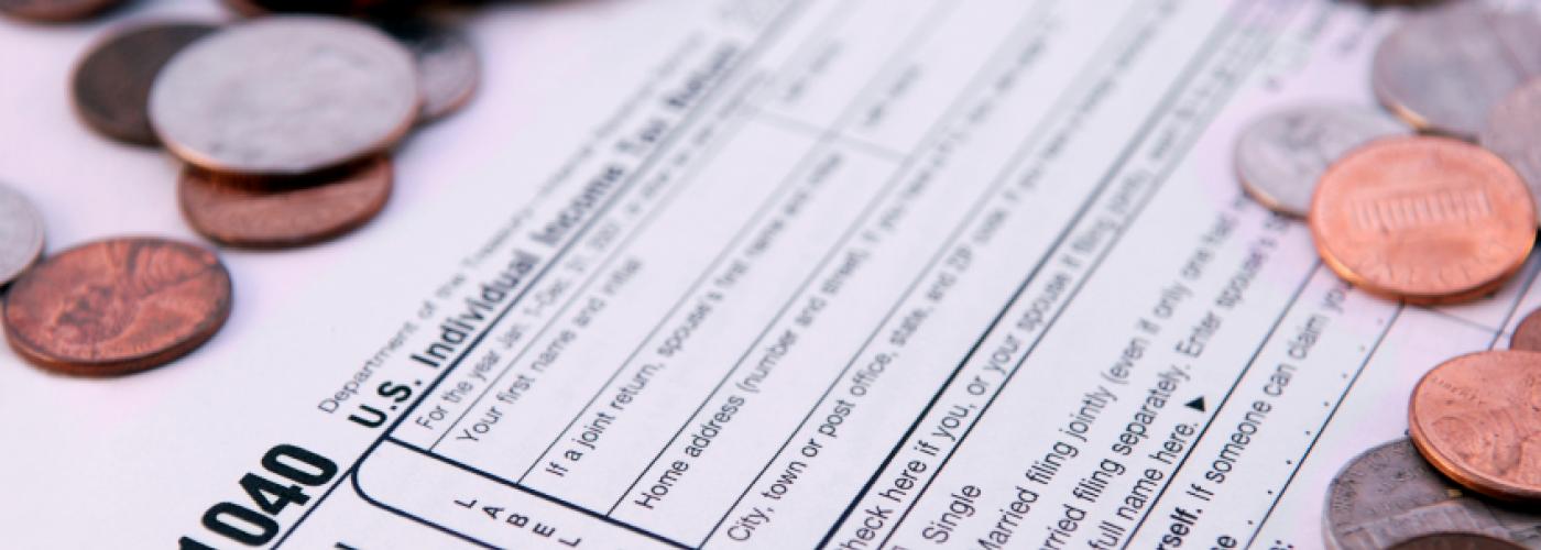 tax form and coins tax form and coins