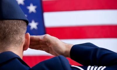 Soldier saluting the U.S. flag